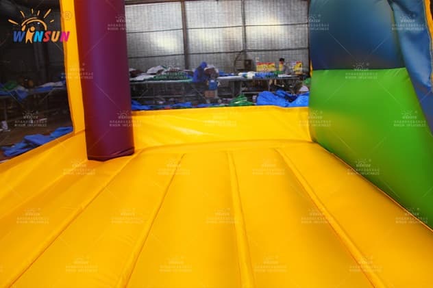Multi-game inflatable playground with covered top and heavy-duty blower