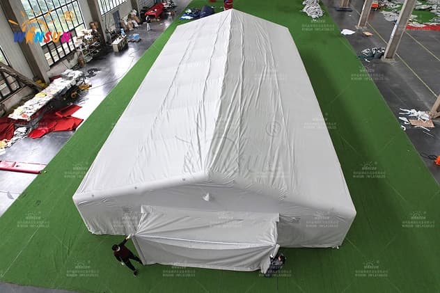 Customizable inflatable outdoor tent with dual-end entrances and modular connectors